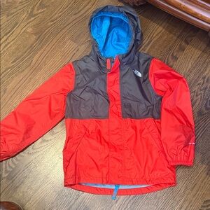 The North Face Kids Red and Gray Hooded Raincoat with Bright Blue Lining